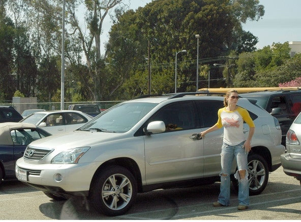 Jessica Biel in front of her silver Lexus car
